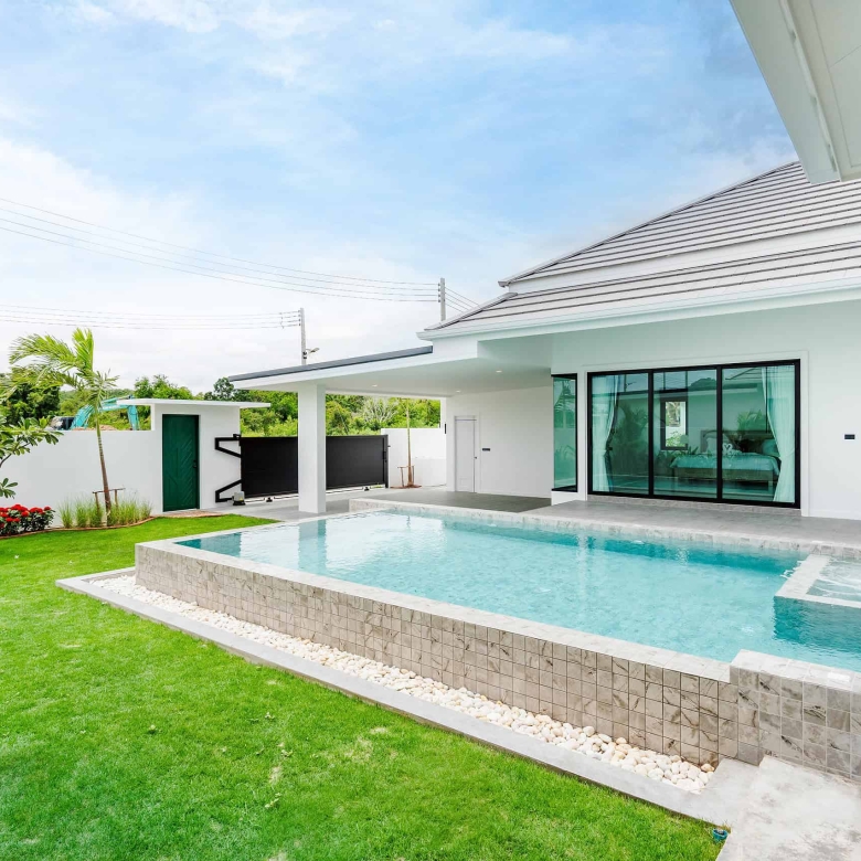 Private swimming pool area with tropical landscaping design