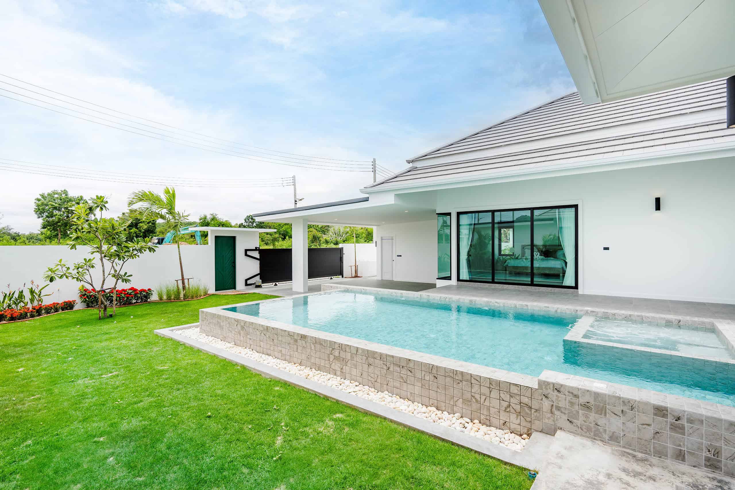 Spacious Family Home with Pool Private swimming pool area with tropical landscaping design