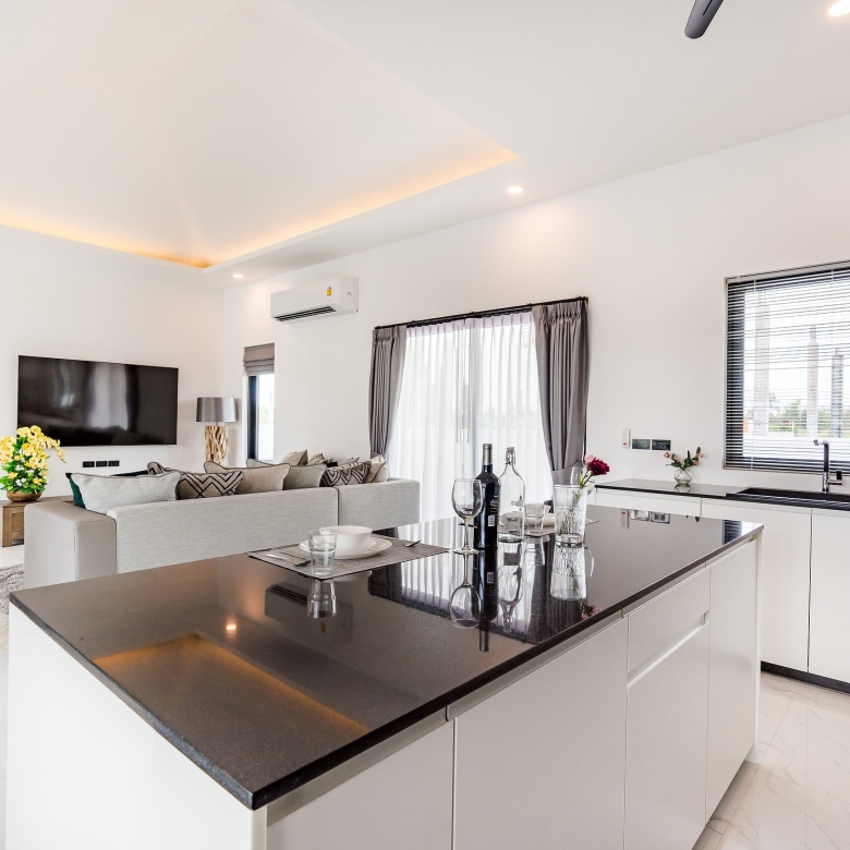 Furnished living room featuring comfortable sofas and lighting