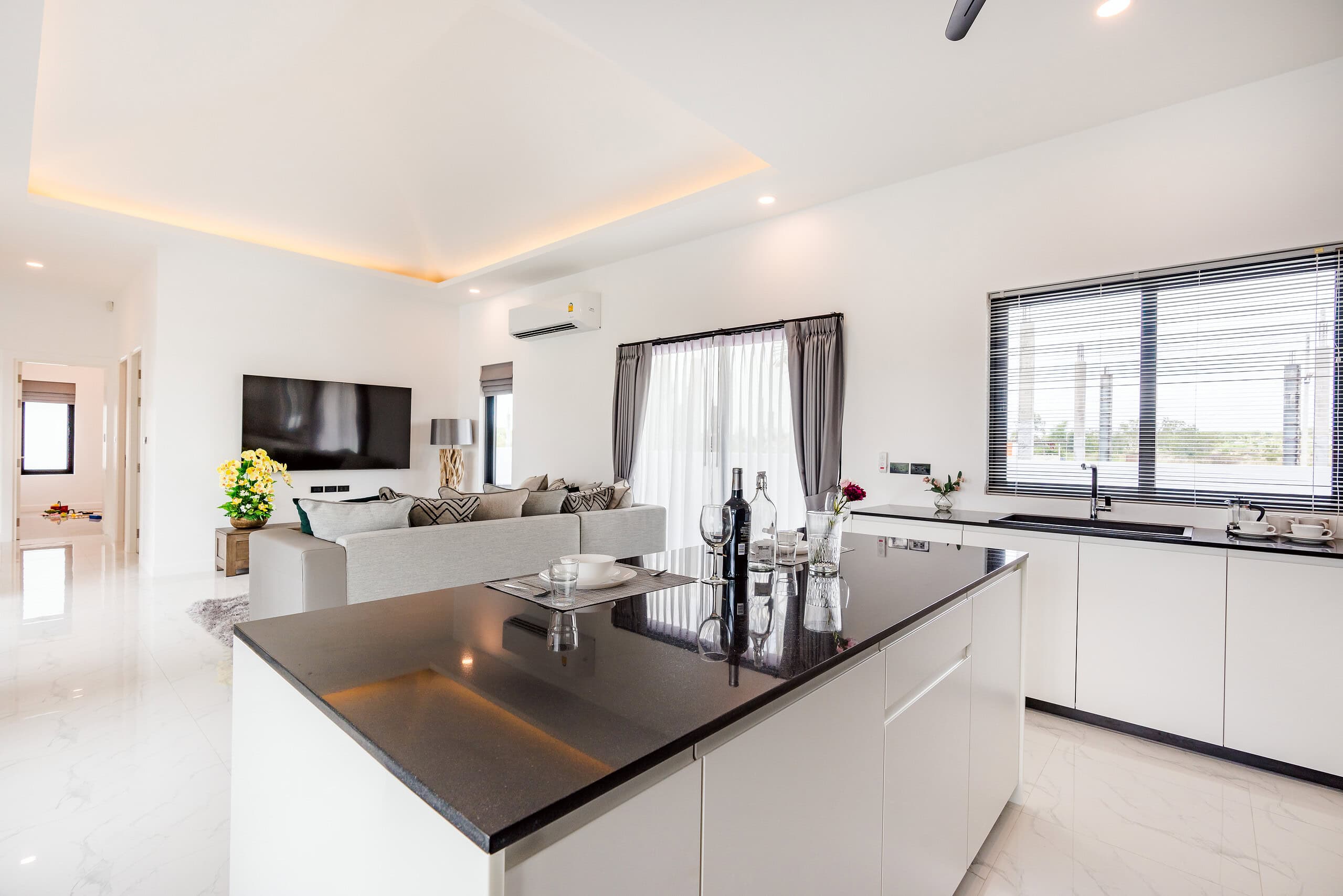 Furnished living room featuring comfortable sofas and lighting