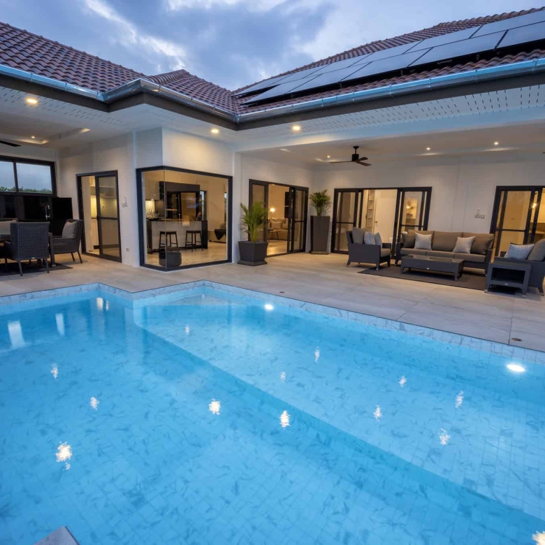 Private swimming pool with tropical landscaping