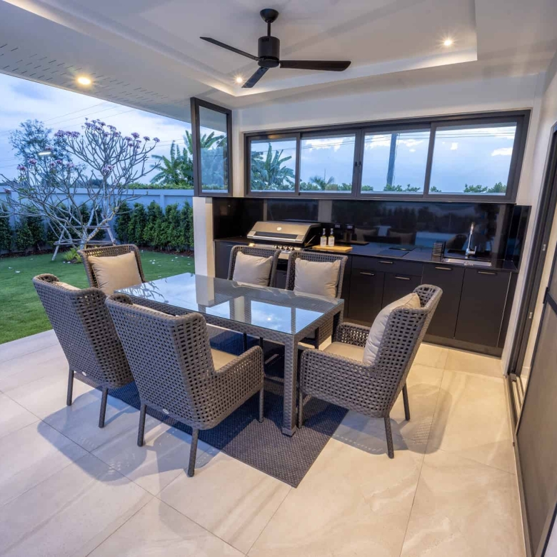 Outdoor terrace dining area overlooking gardens