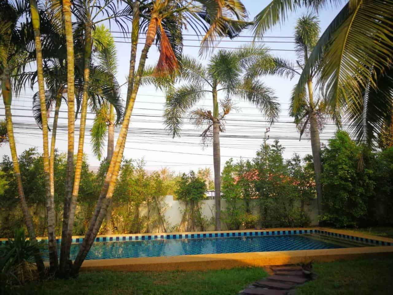 Pool Villa Living Room Comfortable Seating Modern Villa Tropical Garden Mountain Backdrop Views